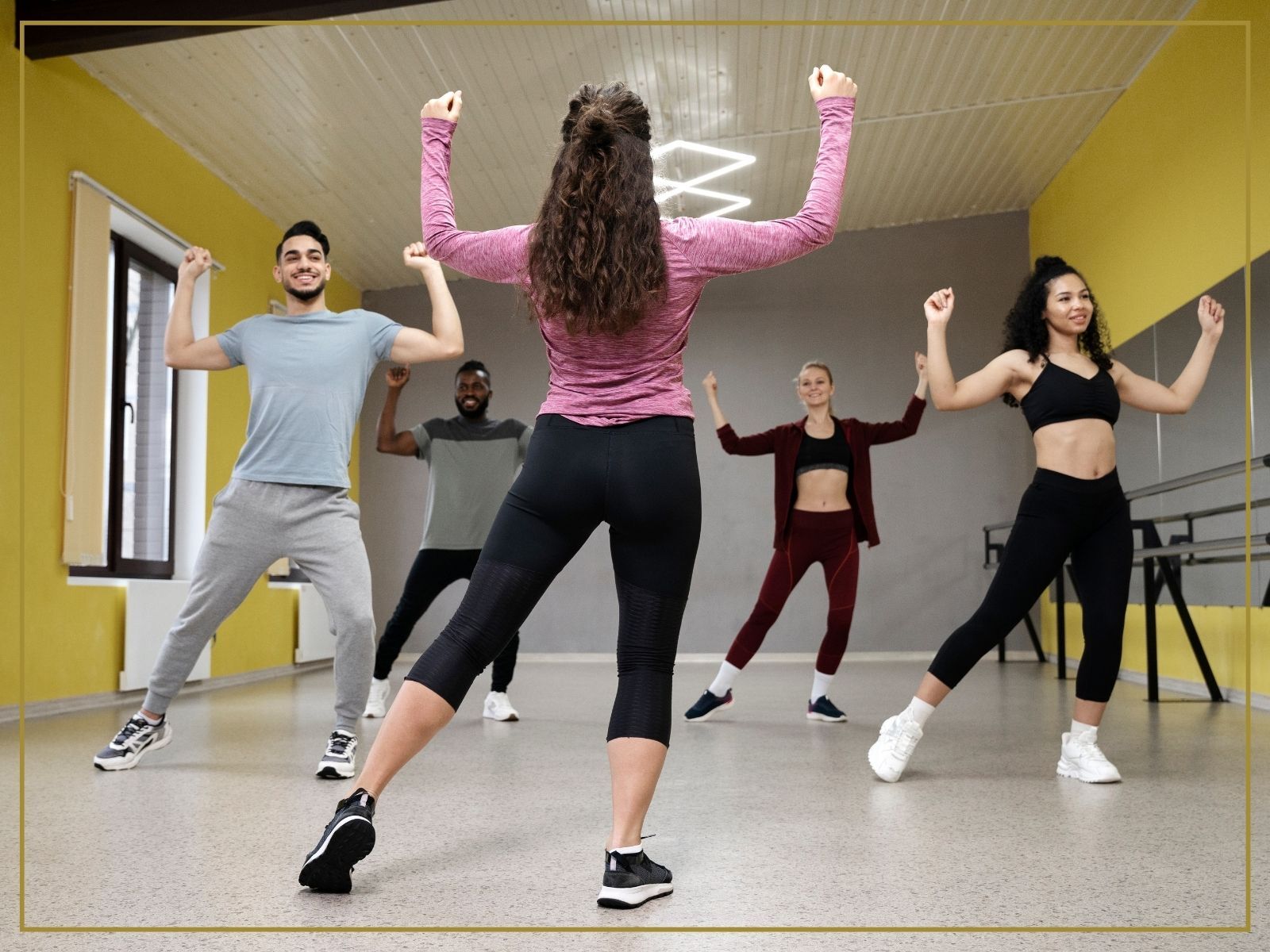 4 people dancing in a studio