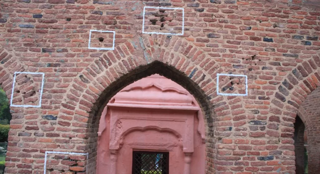 gate made up of red bricks