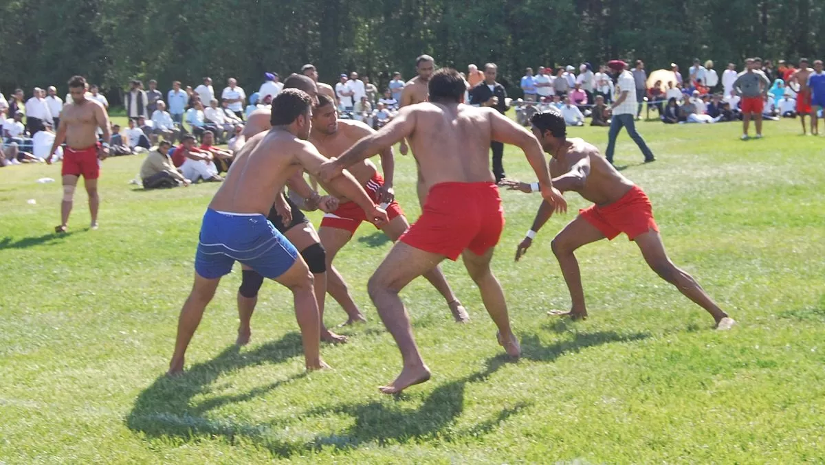 A group of people playing Kabaddi.