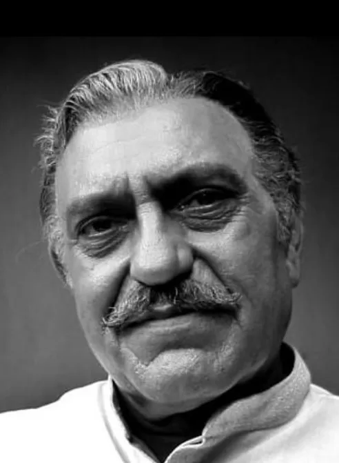 Amrish Puri wearing white colored clothes