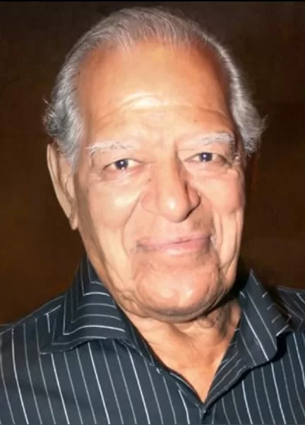 Dara Singh wearing a striped formal shirt