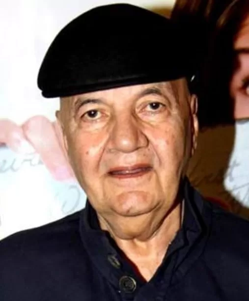 Prem Chopra wearing black hat 