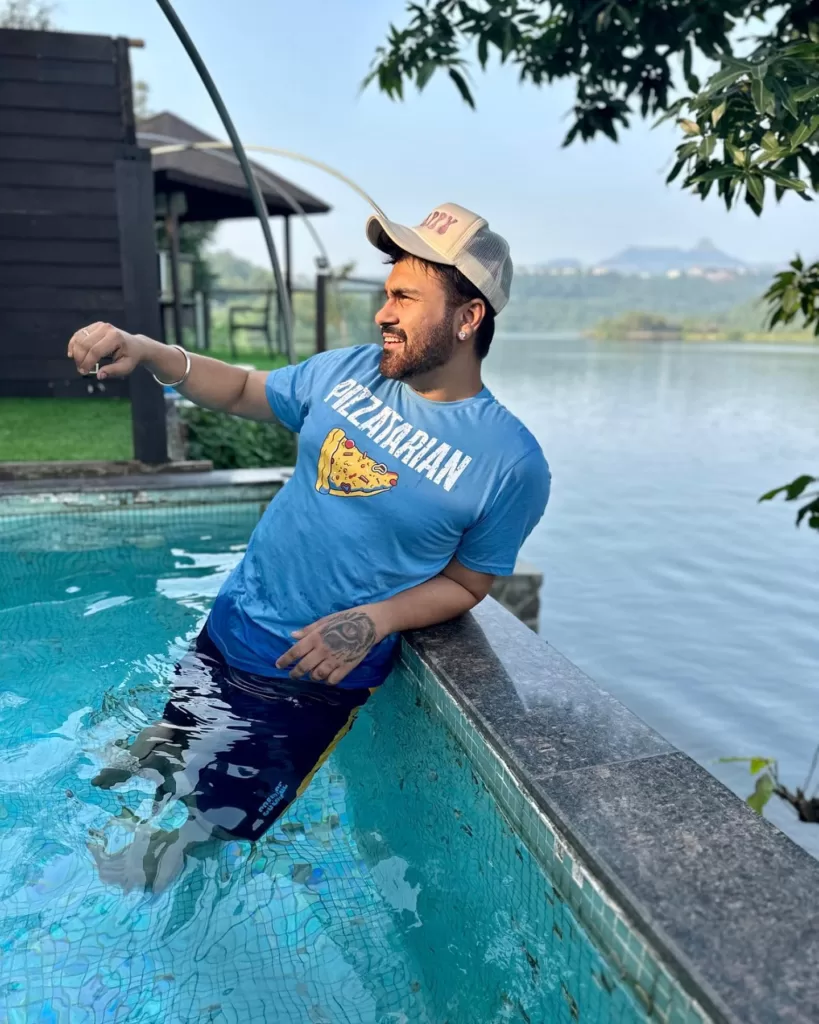 Arya Babbar enjoying in a swimming pool.