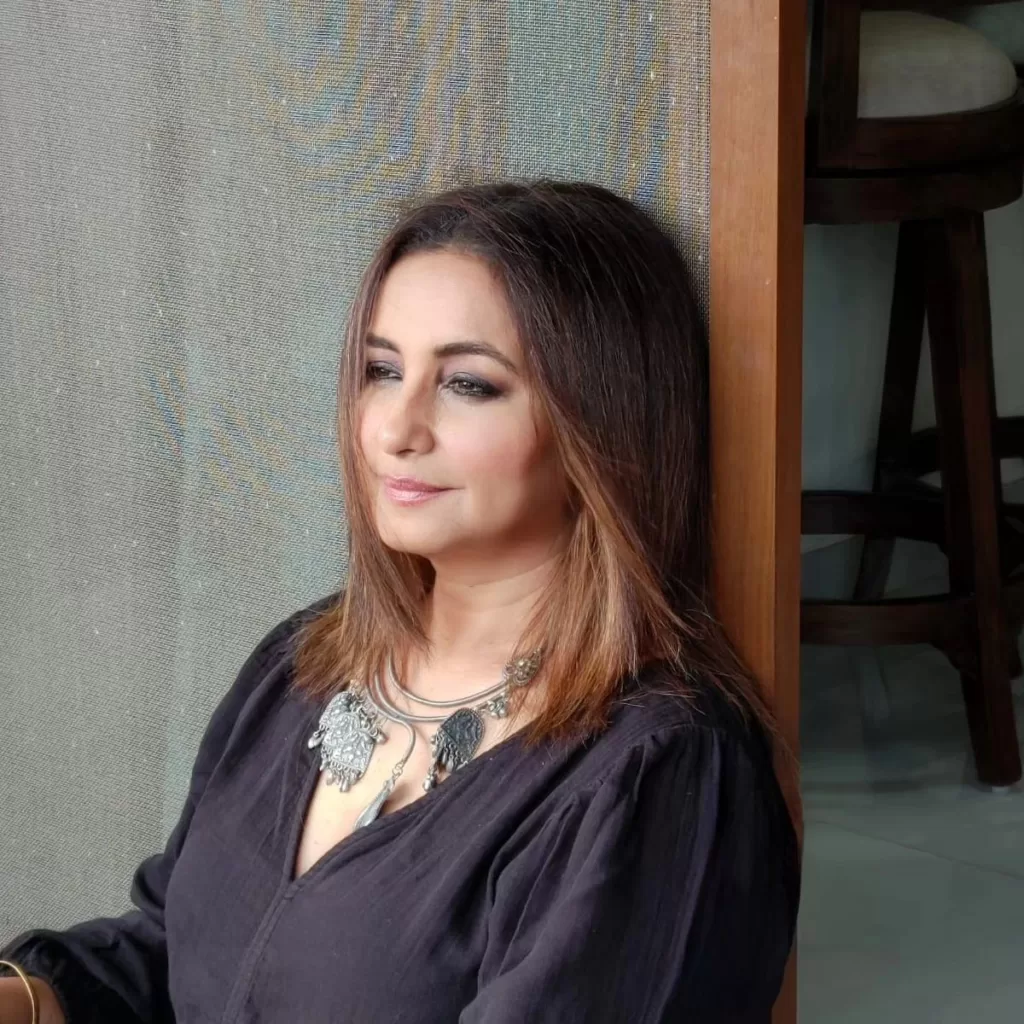 Divya Dutta wearign a black colored dress and oxidised jewellery.