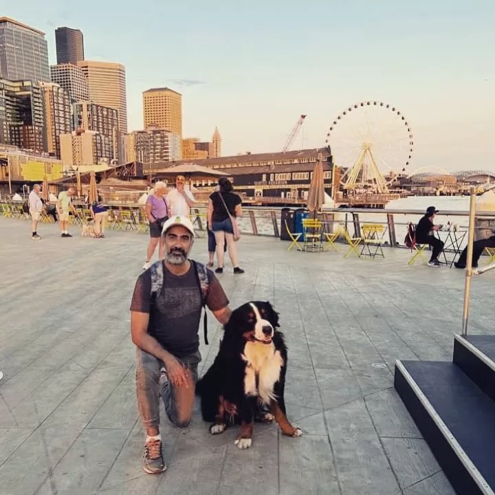 Ranvir Shorey posing with a dog.