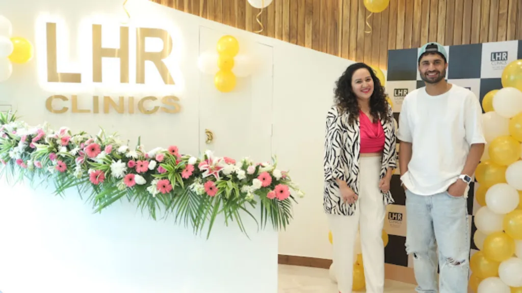 Skin care expert posing with Jassie Gill at LHR clinic