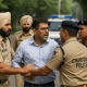Police Clash Over Arrest of Man Accused of Forging Signatures